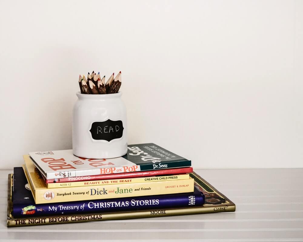 Stacked books and pencils